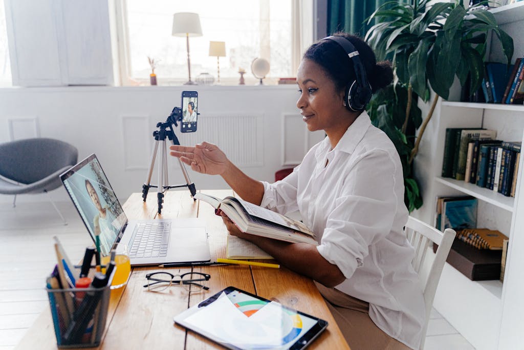 Woman Talking to a Person on Laptop